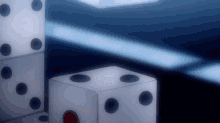 a stack of white dice with black dots and a red circle in the middle