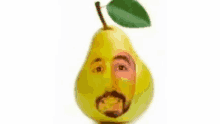 a pear with a man 's face painted on it and a leaf .