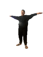 a man with his arms outstretched is wearing a black hoodie and sweatpants