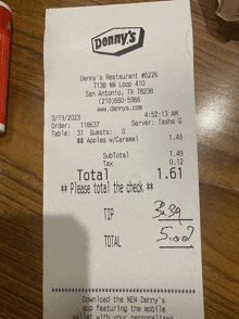 a receipt for denny 's restaurant # 6226 is on a table