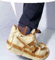 a person wearing a pair of slippers that look like nike shoes