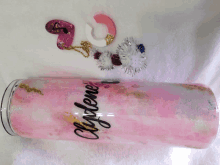 a pink and white tumbler with the name clydene written on it