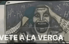 a drawing of the joker on a chalkboard with the words `` vete a la verga '' .