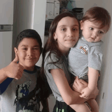 a boy and a girl are posing for a picture and the girl is wearing a shirt that says i love you