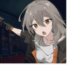 a girl with long hair is pointing at something