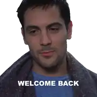 a man with a blanket around his neck and the words welcome back written below him
