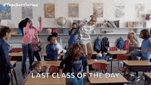 a group of children are dancing in a classroom with the words `` last class of the day '' written on the screen .