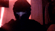 a silhouette of a person with a white spot on their head