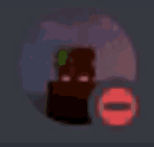 a blurred image of a cube with a red circle and a red circle with an o on it .