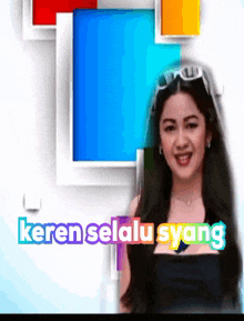 a woman stands in front of a colorful background with the words keren selalu syang on it