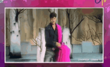 a picture of a man holding a pink blanket with the caption courtesy cmmn tv