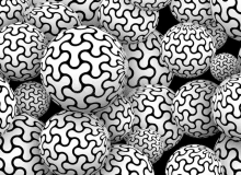 a bunch of white balls with a black pattern on them