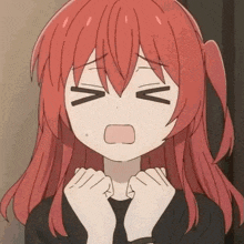 a girl with red hair is making a surprised face with her hands on her face .