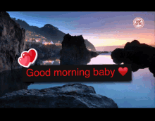 a sign that says good morning baby with a heart