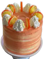 a cake with whipped cream and oranges on top