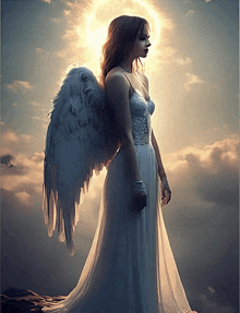 a woman in a white dress with angel wings stands in front of the sun