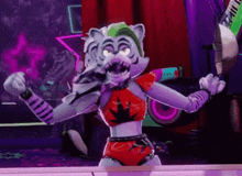 a cartoon character from five nights at freddy 's is dancing on a stage in a room .