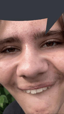 a close up of a young man 's face with a speech bubble in the background