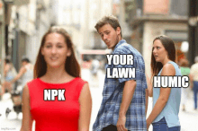 a man walking down a street with a woman looking at him and the words your lawn npk humic written on it