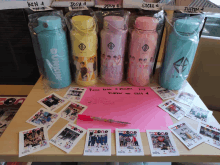 several water bottles are lined up on a table with a note that says please look at pictures for d.new no 4914