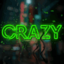 a neon sign that says crazy on a dark background