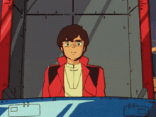 a man in a red jacket and white shirt is sitting in front of a window