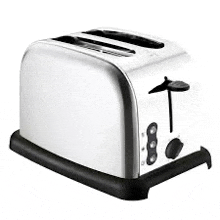 a stainless steel toaster is sitting on a white surface .