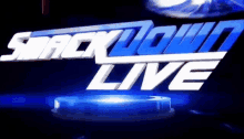 a logo for smackdown live is shown on a dark background