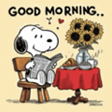 snoopy is sitting at a table with a vase of sunflowers and a newspaper .