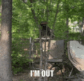 a man in a military uniform stands behind a chain link fence with the words i 'm out below him