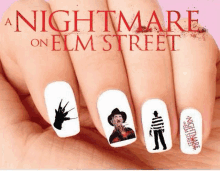 a close up of a person 's nails with a nightmare on elm street nail art design .