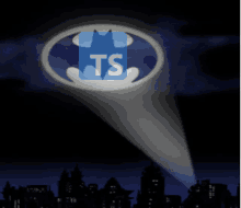 a spotlight shines on a batman logo with the letters ts on it