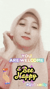 a woman wearing a pink hijab says you are welcome