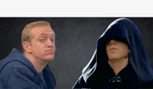 a man in a blue hoodie and a man in a black hood