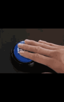 a person is pressing a blue button that says f on it