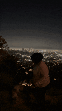 a woman is standing in front of a city at night and the word shagarita is on the bottom right