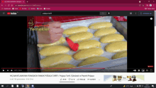 a video on youtube shows a person spreading dough on a pan