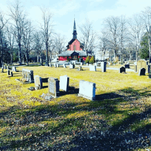 a cemetery with a church in the background