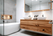 a bathroom with two sinks and a bathtub in it