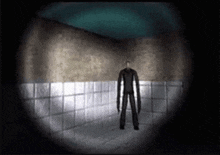 a slender man is standing in a dark room with a spotlight shining on him .