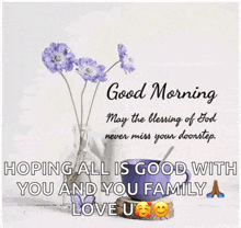 a picture of purple flowers in a vase with a good morning message