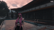 a woman with pink hair is standing next to a pool in front of a building that says evolution games