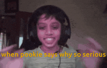 a young boy wearing headphones with the words when pookie says why so serious