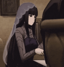 a woman with long black hair and a veil is sitting in a chair