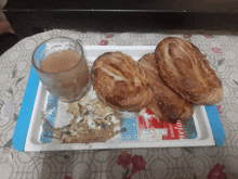 two pastries and a glass of tea on a tray that says sonic watermelon