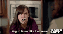 a girl with yogurt on her face says " yogurt is not like ice cream ! "