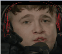 a man wearing headphones and a microphone has a red line drawn around his head