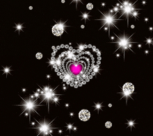 a heart made of diamonds and a pink heart in the middle