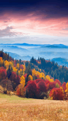 a painting of a mountain range with trees in the foreground