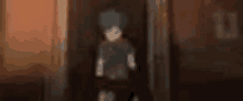 a blurry image of a person standing in a doorway .